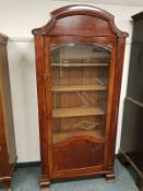 A Continental mahogany glazed single door cabinet, width 88 cm.