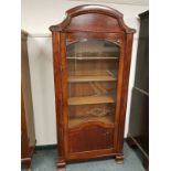 A Continental mahogany glazed single door cabinet, width 88 cm.