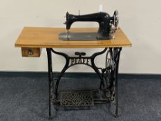 A 20th century Pfaff treadle sewing machine table