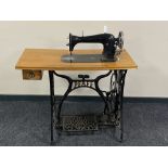 A 20th century Pfaff treadle sewing machine table