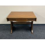 An antique inlaid mahogany flap sided sofa table