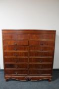 A 20th century continental mahogany fourteen drawer chest