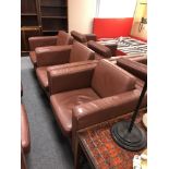 Three contemporary brown leather look armchairs