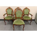 A set of four Italian style dining chairs