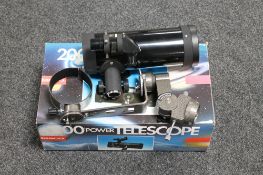 A boxed Tasco 200 power telescope