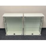 A pair of double glass door display cabinets fitted with shelves