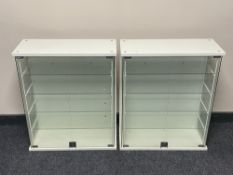 A pair of double glass door display cabinets fitted with shelves