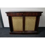 A Regency mahogany bookcase with pillar column supports