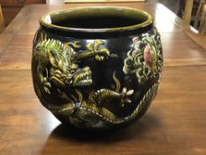 A Bretby glazed pottery 'Dragon' jardiniere, width 32 cm.