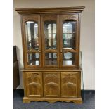 An American style triple door display cabinet