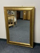 A gilt framed overmantel mirror