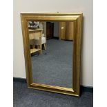 A gilt framed overmantel mirror