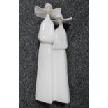 A Lladro figure of two nuns