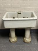 A Victorian porcelain sink on twin pedestal