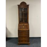 A Regency style domed topped bureau bookcase