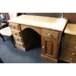 A pine desk fitted five drawers