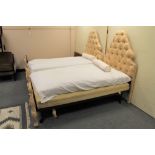 A 3'6" antique French bed frame in a cream classic fabric with horse hair mattress and base