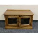 An Ercol double door entertainment stand