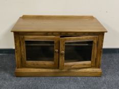 An Ercol double door entertainment stand