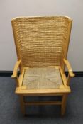 A 20th century oak and wicker Orkney armchair