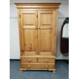 A good quality pine double door wardrobe,