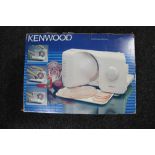 A boxed Kenwood meat slicer