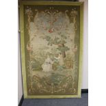 A large framed tapestry depicting figures playing musical instruments