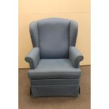 A 20th century wingback armchair in blue fabric