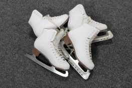 Two pairs of vintage ice skates