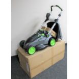 A G-Tech cordless electric lawn mower model number CLM001, with grass box, leads,