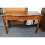 An early 20th century serpentine fronted hall table