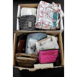 Two boxes of assorted lady's handbags