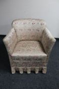 A mid 20th century bedroom armchair