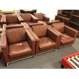 Three contemporary brown leather look armchairs
