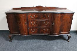 A serpentine fronted mahogany sideboard CONDITION REPORT: 153cm wide by 47cm deep.