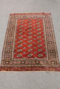 An Afghan Tekke rug on red ground