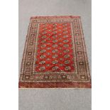 An Afghan Tekke rug on red ground