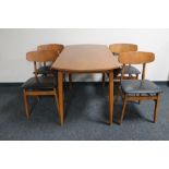A 20th century teak drop leaf table and four chairs
