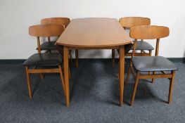 A 20th century teak drop leaf table and four chairs