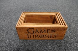 Set of four graduated pine caddies bearing Game of Thrones decoration