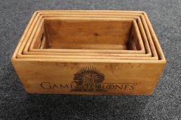 Set of four graduated pine caddies bearing Game of Thrones decoration