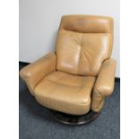 A tab leather swivel reclining armchair on wooden base