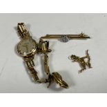 A 9ct gold and diamond bar brooch, similar archer charm and earring,