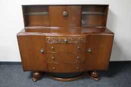 A mid 20th century oak buffet back sideboard