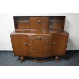 A mid 20th century oak buffet back sideboard