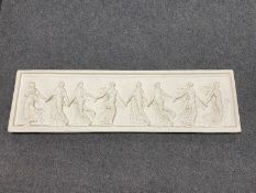 A chalk frieze panel depicting eight Roman figures holding hands