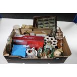 A box of assorted figures, vintage tin, brass dishes, framed train cigarette cards,