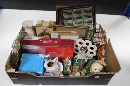 A box of assorted figures, vintage tin, brass dishes, framed train cigarette cards,