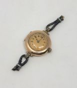 A 9ct gold lady's wristwatch with Rolex movement