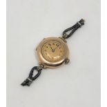 A 9ct gold lady's wristwatch with Rolex movement